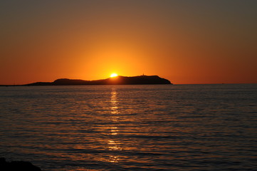 Fototapeta premium Sunset over the island Illa sa Conillera in Ibiza Spain