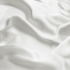 Elegant white satin silk with waves, abstract background