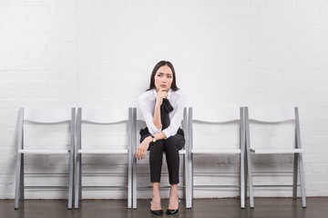 Fototapeta premium thoughtful asian businesswoman waiting for job interview