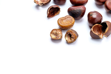 Fototapeta na wymiar Roasted chestnuts on a white background.