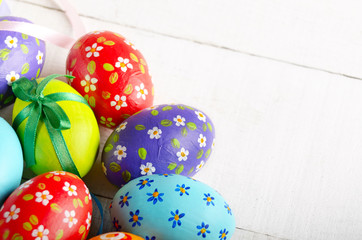 Painted decorated easter eggs on white table