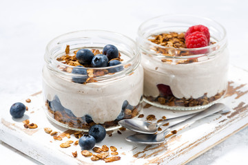 healthy creamy dessert with berries, horizontal