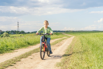 Fototapeta premium Happy boy running on the field