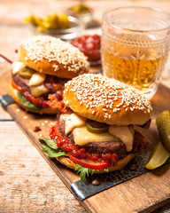 Two cheeseburgers on sesame buns
