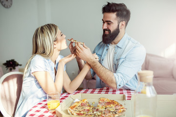 Couple eating pizza