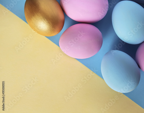 Pastel Colored Easter Eggs On Abstract Geometrical Soft Blue