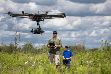 People playing with RC quadrocopter 
