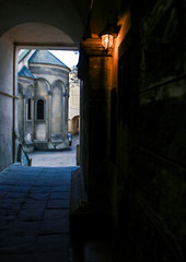Fototapeta premium Small Church in Yard out off Dark Porch Lantern on Wall