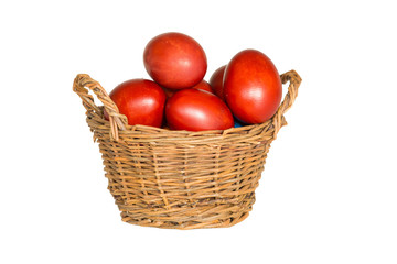 red easter eggs in a wicker basket