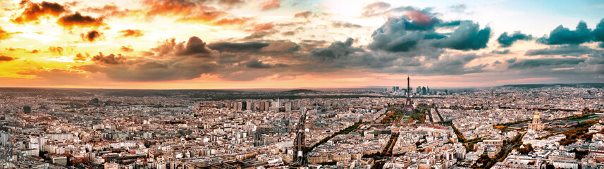 Fototapeta na wymiar Aerial Paris view in late autumn at sunset. Eiffel Tower in the distance and financial district.
