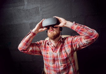 The young man wearing virtual reality goggles