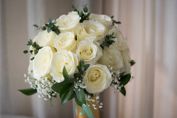 White rose flower bouquet in bundle shape for bridal in wedding ceremony