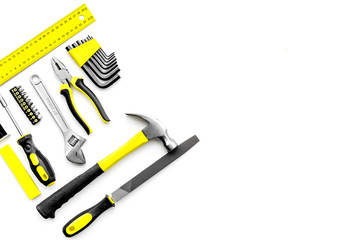 Various repair tools. Must-have for men. Equipment for building. White background top view copy space pattern