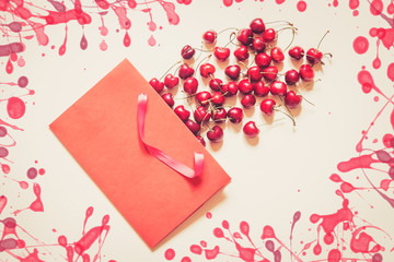 Cherries berries in paper bag on beige background
