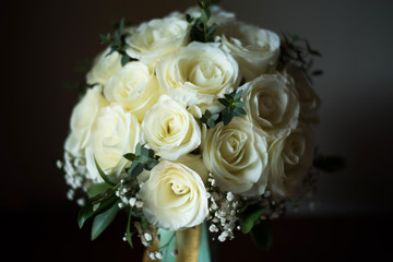 White rose flower bouquet in bundle shape for bridal in wedding ceremony