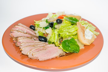roasted duck slices with salad