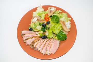 roasted duck slices with salad