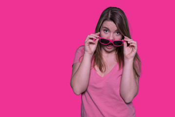 Beautiful blonde woman with sunglasses on her head. Funny woman on isolated background