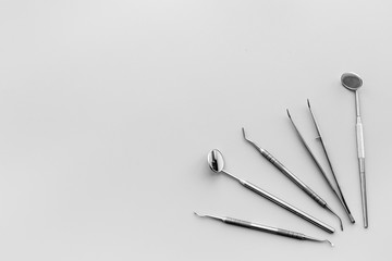Dentist tools. Teethcare, dental health concept. Grey background top view copy space