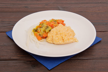 Rice sweet potato mash and vegetables on a table
