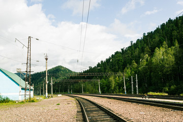 Railway tracks at the station on a summer day