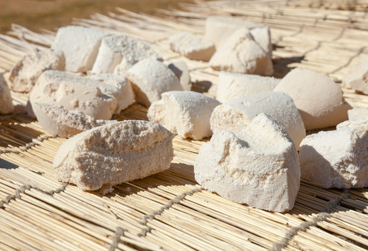 Mongolian Aaruul or Gurt hard cheese  drying on sun