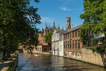 Fototapeta na wymiar Typical medieval Flemish architecture of Bruges, Belgium. Red brick houses standing on canals