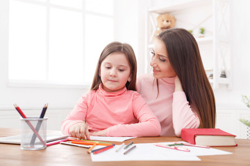 Mother drawing with her daughter