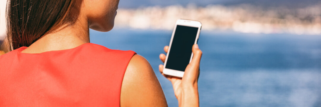 Businesswoman Holding Phone Looking At Screen