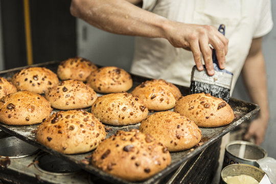 chilindrina bread in the tray being decorated