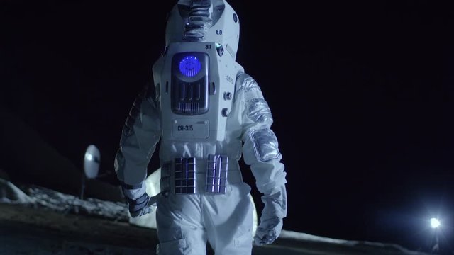 Courageous Astronaut in the Space Suit Walks on the Surface of the Alien Planet. Exploring Newly Discovered Planet. Interstellar Space Travel. Shot on RED EPIC-W 8K Helium Cinema Camera.