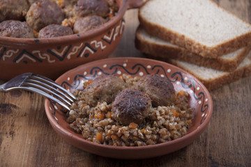 Meatballs with buckwheat porridge in a  dish