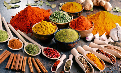 Variety of spices and herbs on kitchen table