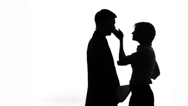 Woman slapping her boss for soliciting her in workplace, womens rights, shadows