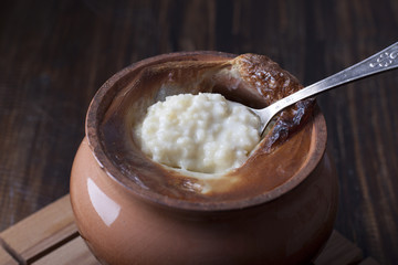 In a clay pot millet porridge