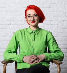 Shooting in the Studio. Portrait of a young girl with big glasses.
