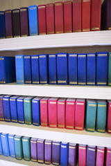 various of colourful books on shelf