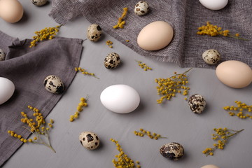 Eggs with flowers and decorative elements on concrete.