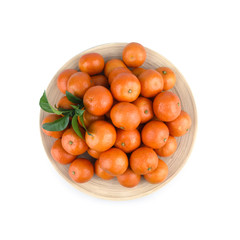 Heap of mandarin in bamboo plate isolated on white background. Food photography