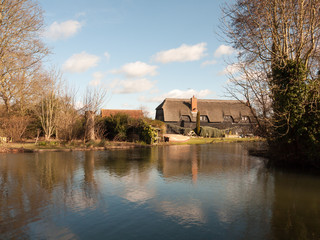 flatford black farm house mill house cottage from across the water