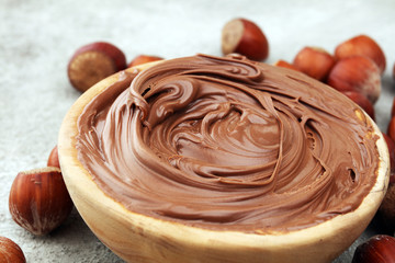 Homemade hazelnut spread in wooden bowl. Hazelnut Nougat cream