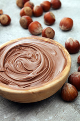 Homemade hazelnut spread in wooden bowl. Hazelnut Nougat cream
