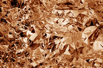 Bronze colored crushed foil textured background