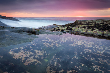 Sunrise at coastline nearby Pemaquid Point lighthouse, Maine, USA