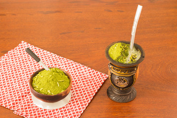 Mate or chimarrao its a traditional drink from South America drink in a calabash (gourd) with yerba mate drink, top view, freshly made, hot ethnic drink.