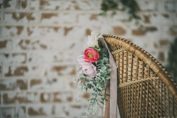 straw armchair with flowers