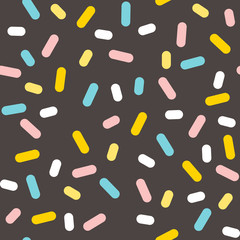seamless pattern of colored sprinkles in vector
