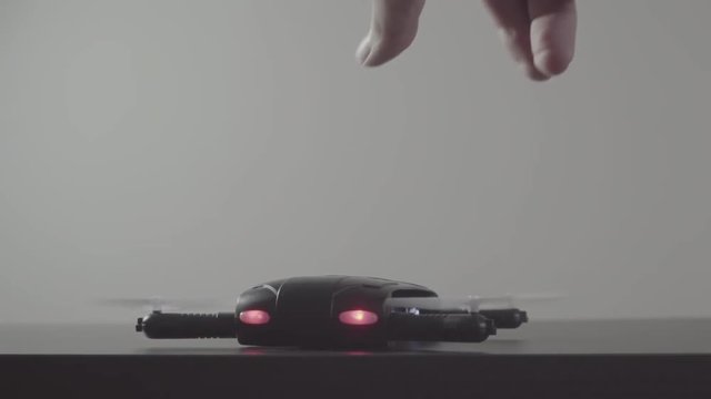 Futuristic transportation concept.Micro drone take off from laptop computer