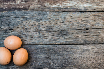 Egg concept placed on old wooden floor