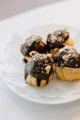 Small dessert cakes with chocolate on the top.